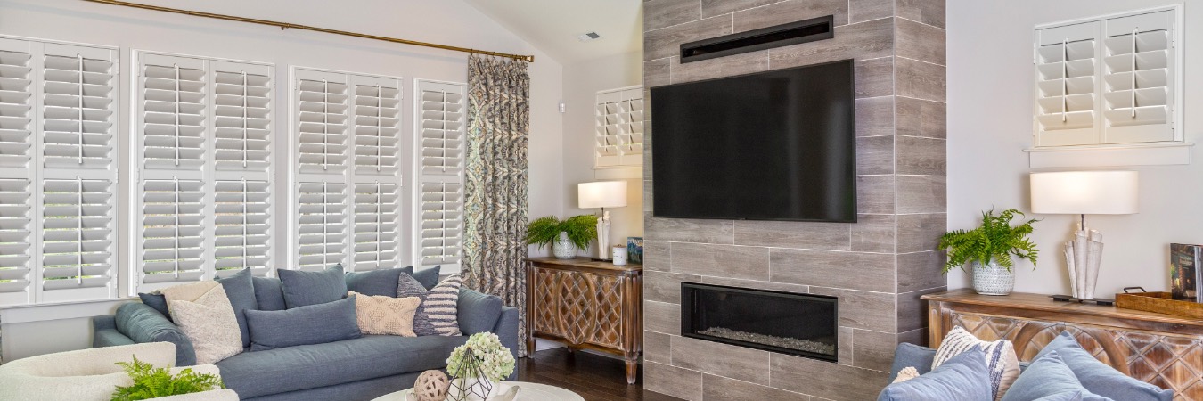 Interior shutters in Arlington family room with fireplace
