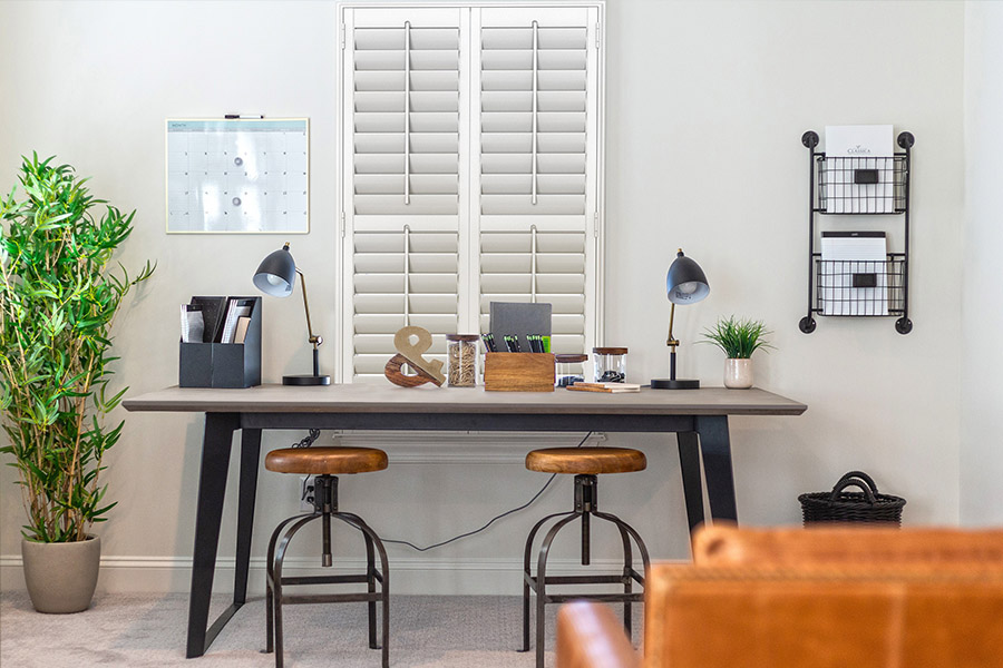 White Polywood shutters on a home office window